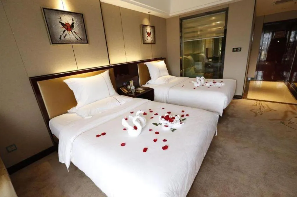 Bed in Xin Sheng Da Hong Sheng International Hotel