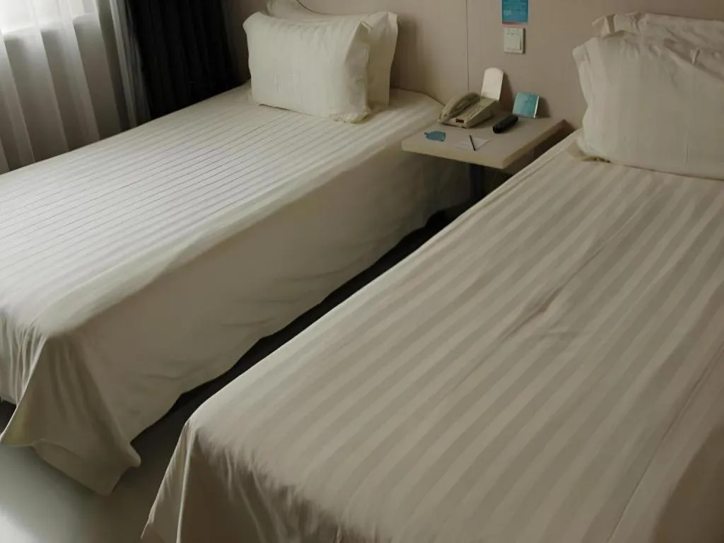 Bed in Jinjiang Inn Beijing Huairou Qingchun Road Wanda Plaza