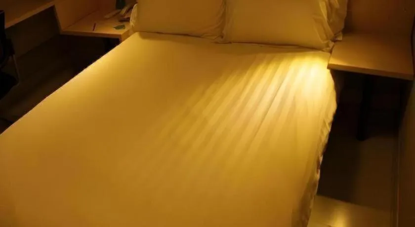 Bed in Jinjiang Inn Beijing Huairou Qingchun Road Wanda Plaza