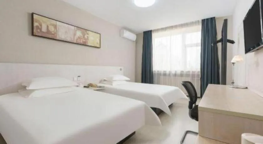 Bed in Jinjiang Inn Dalian Development Zone Jinma Road Light Railway Station