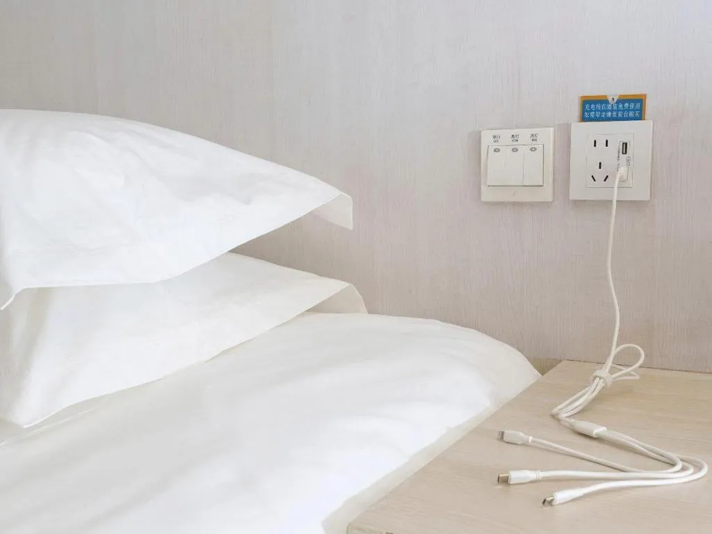 Bed in Jinjiang Inn Dalian Development Zone Jinma Road Light Railway Station