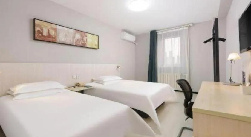 Bed in Jinjiang Inn Dalian Development Zone Jinma Road Light Railway Station