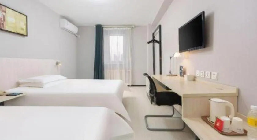 Bed in Jinjiang Inn Dalian Development Zone Jinma Road Light Railway Station