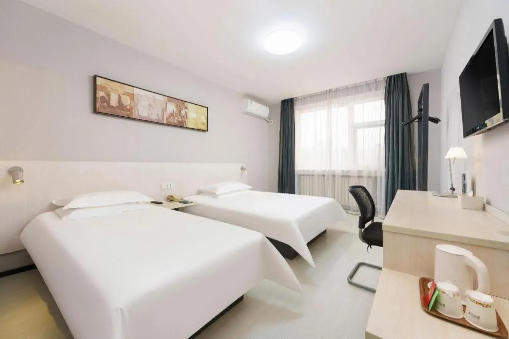 Bed in Jinjiang Inn Dalian Development Zone Jinma Road Light Railway Station