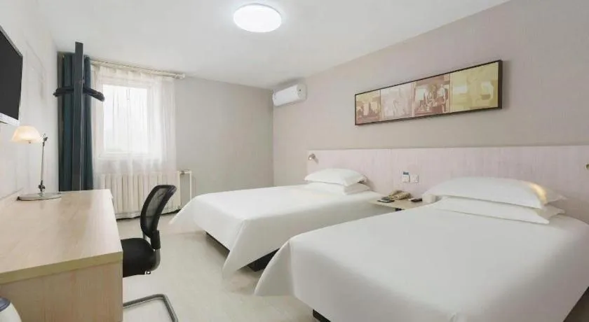 Bed in Jinjiang Inn Dalian Development Zone Jinma Road Light Railway Station