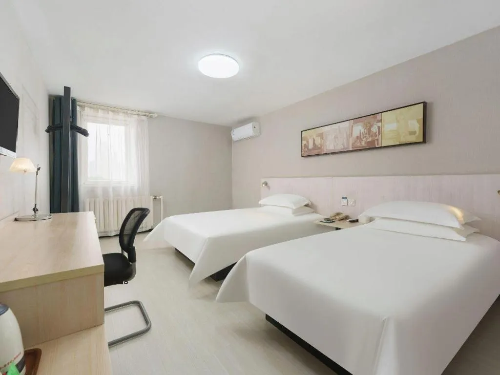 Bed in Jinjiang Inn Dalian Development Zone Jinma Road Light Railway Station