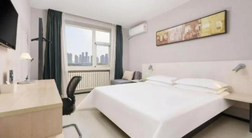 Bed in Jinjiang Inn Dalian Development Zone Jinma Road Light Railway Station