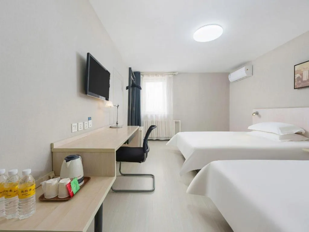 Bed in Jinjiang Inn Dalian Development Zone Jinma Road Light Railway Station