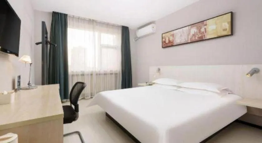 Bed in Jinjiang Inn Dalian Development Zone Jinma Road Light Railway Station
