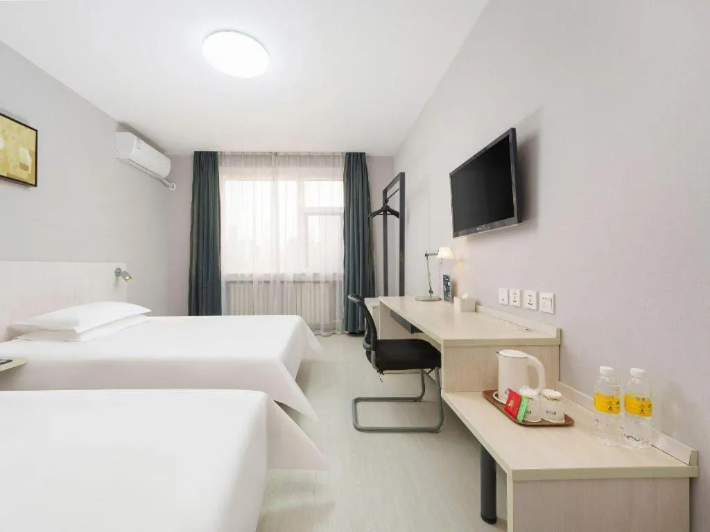 Bed in Jinjiang Inn Dalian Development Zone Jinma Road Light Railway Station