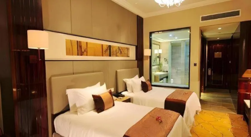 Bed in Maison New Century Hotel Wuyuan Haiyan