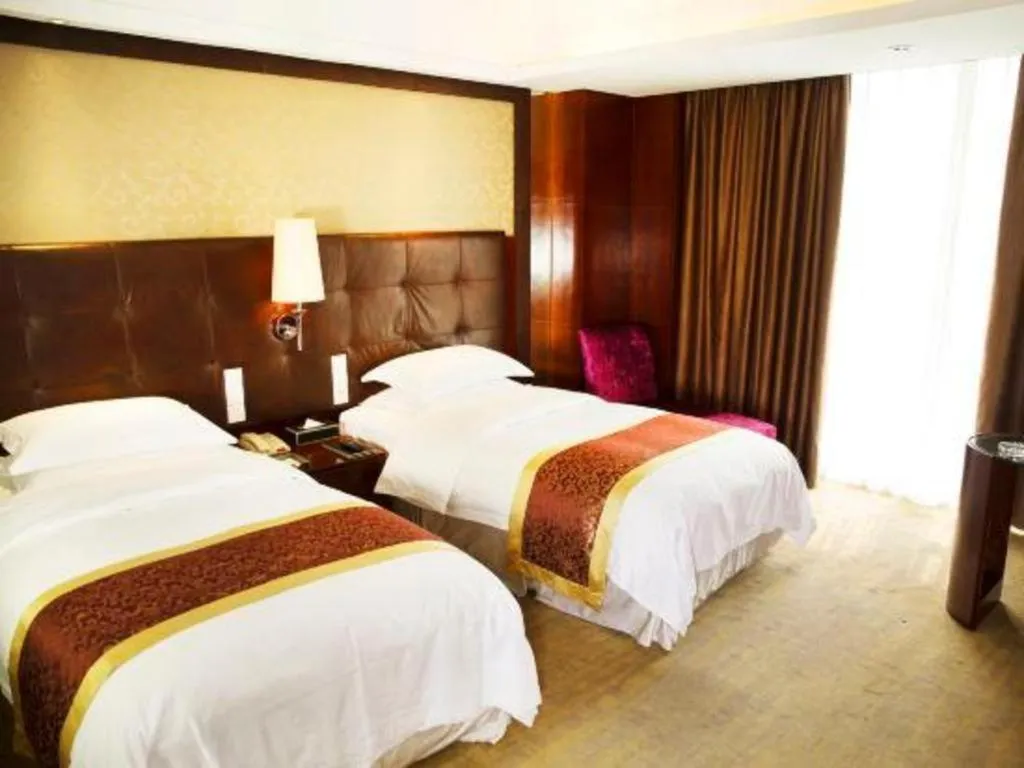 Bed in Maison New Century Hotel Wuyuan Haiyan