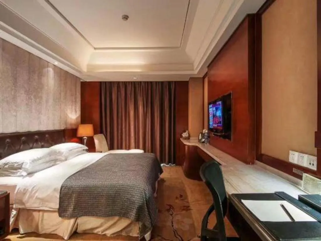 Bed in Maison New Century Hotel Wuyuan Haiyan