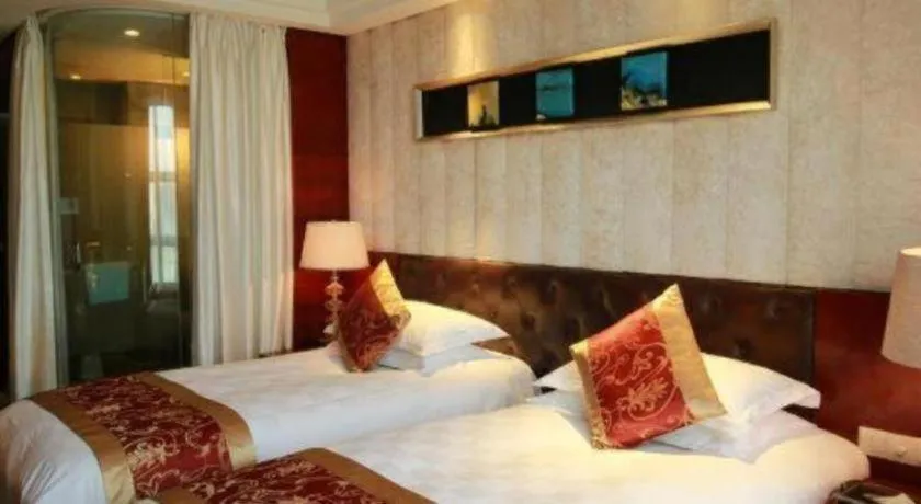 Bed in Maison New Century Hotel Wuyuan Haiyan