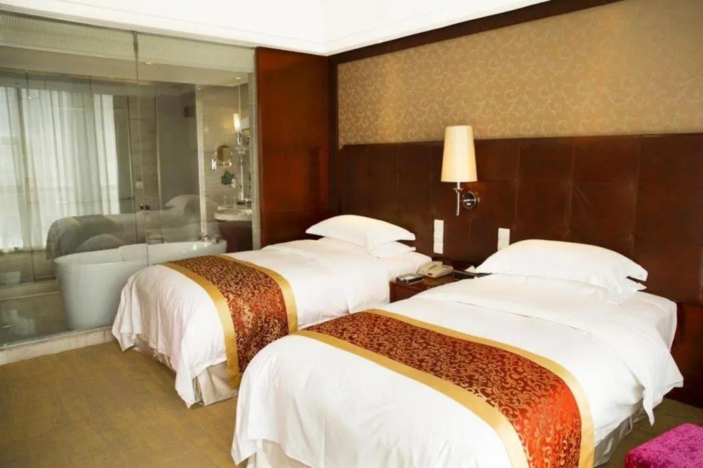 Bed in Maison New Century Hotel Wuyuan Haiyan