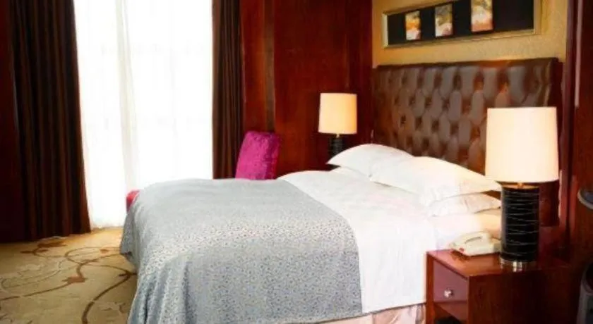 Bed in Maison New Century Hotel Wuyuan Haiyan