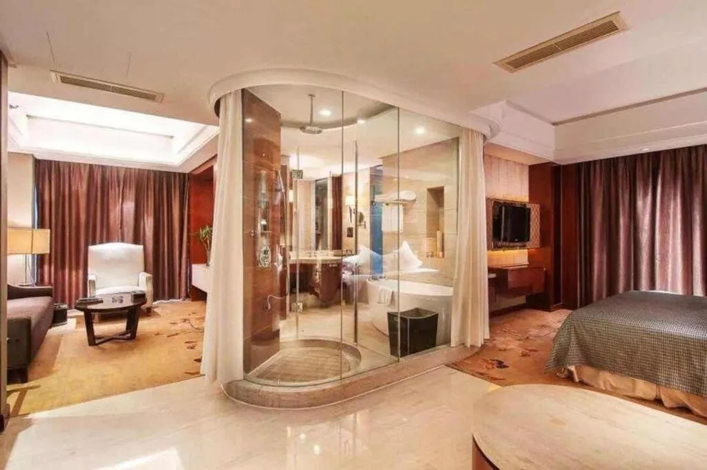 Bed in Maison New Century Hotel Wuyuan Haiyan