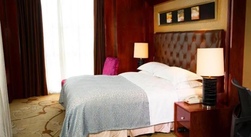 Bed in Maison New Century Hotel Wuyuan Haiyan