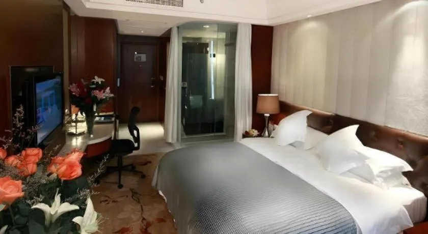 Bed in Maison New Century Hotel Wuyuan Haiyan