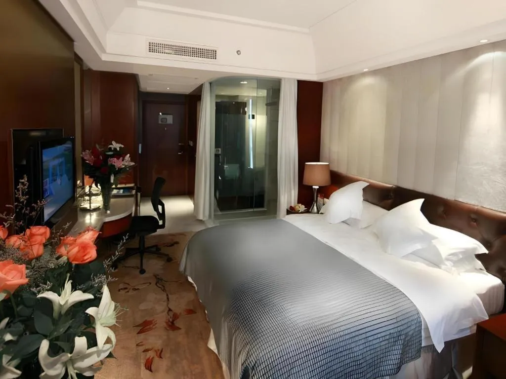 Bed in Maison New Century Hotel Wuyuan Haiyan