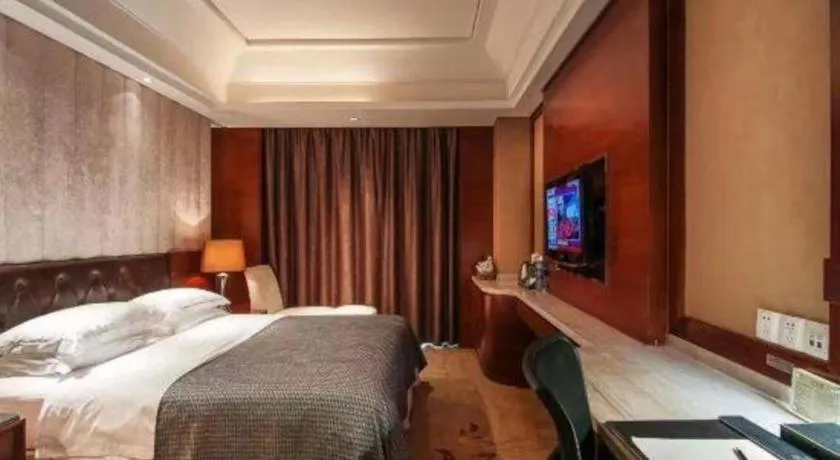 Bed in Maison New Century Hotel Wuyuan Haiyan