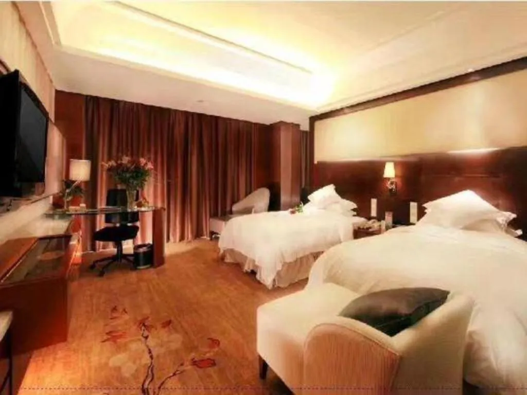 Bed in Maison New Century Hotel Wuyuan Haiyan