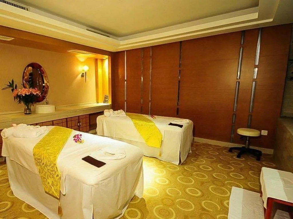 Bed in Maison New Century Hotel Wuyuan Haiyan