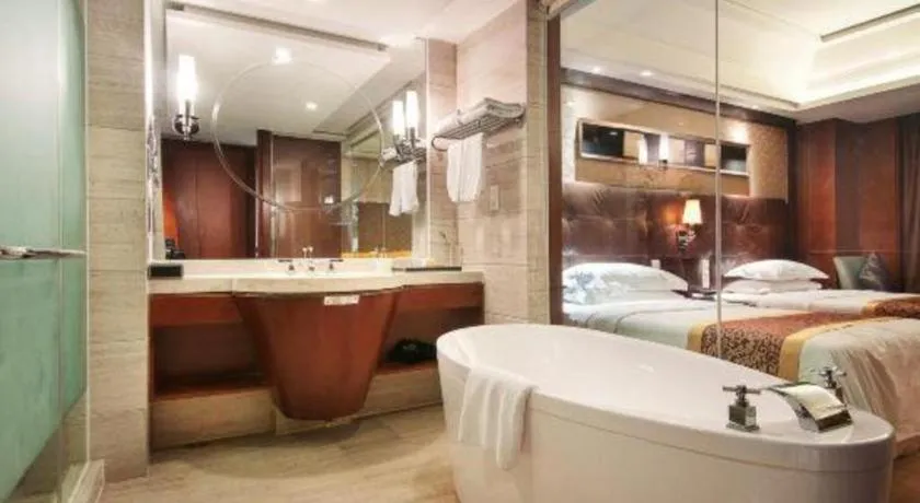 Bed in Maison New Century Hotel Wuyuan Haiyan