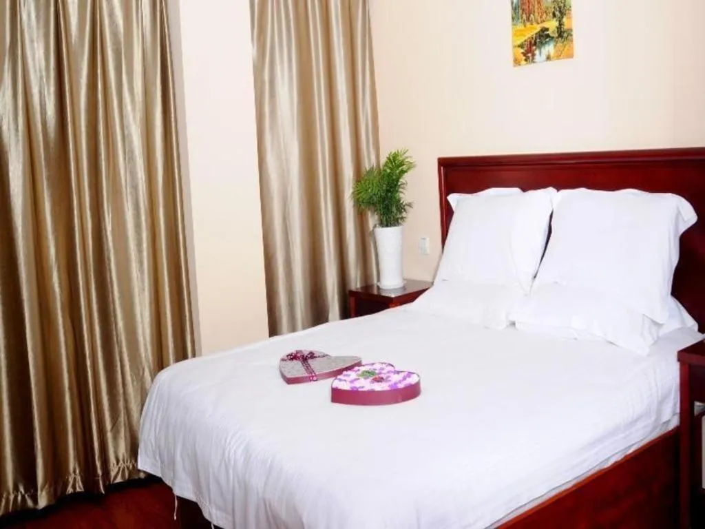 Bed in GreenTree Inn Huaian Lianshui Jindi International Garden Business Hotel