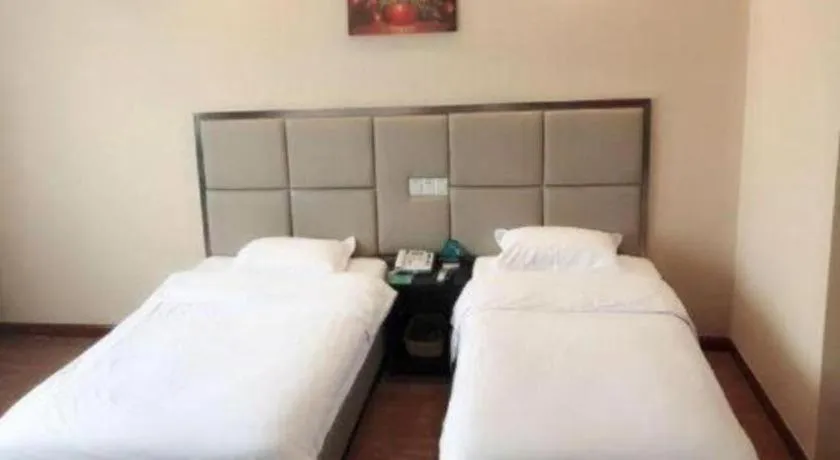Bed in GreenTree Inn Huaian Lianshui Jindi International Garden Business Hotel