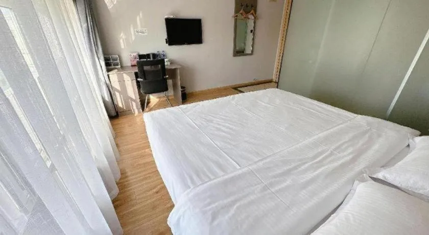 Bed in GreenTree Inn Huaian Lianshui Jindi International Garden Business Hotel