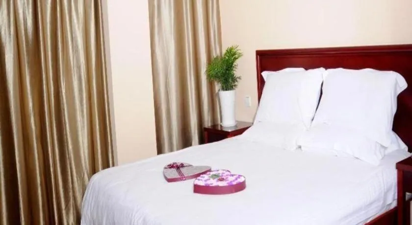Bed in GreenTree Inn Huaian Lianshui Jindi International Garden Business Hotel