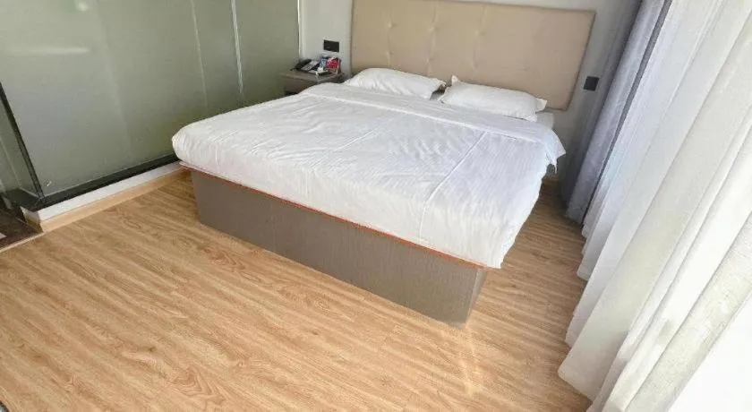 Bed in GreenTree Inn Huaian Lianshui Jindi International Garden Business Hotel