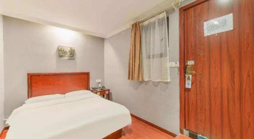 Bed in GreenTree Inn Shanghai South Railway Station Xujiahui Stadium Subway Station Shell Hotel
