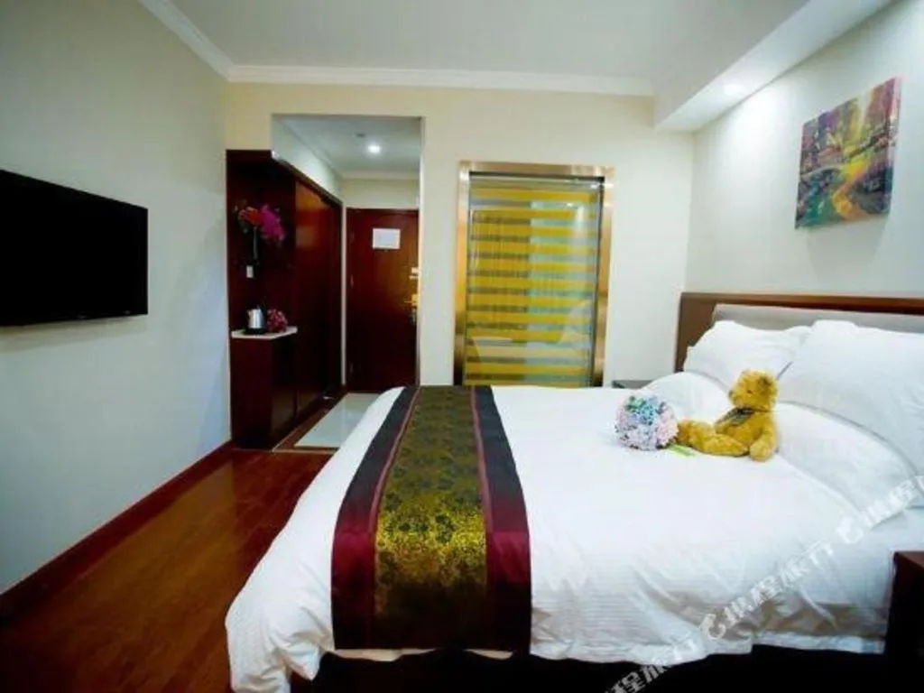 Bed in GreenTree Inn Shanghai South Railway Station Xujiahui Stadium Subway Station Shell Hotel
