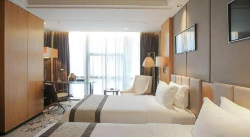 Bed in Zhangjiagang Zhonglian GDH International Hotel