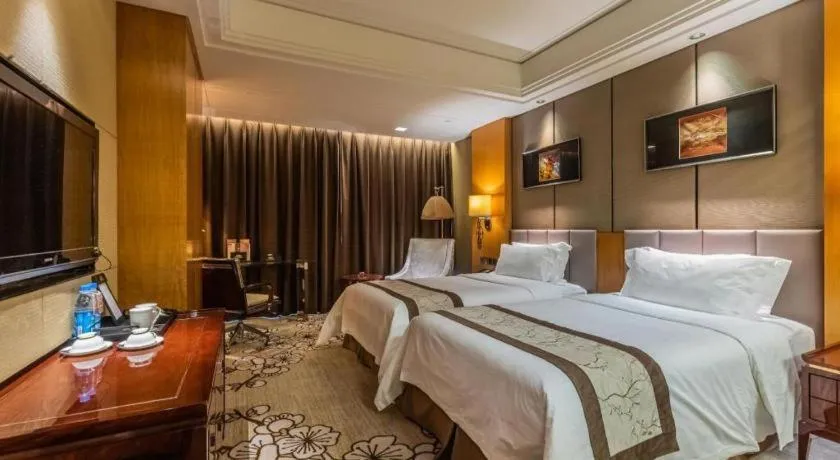 Bed in Zhangjiagang Zhonglian GDH International Hotel