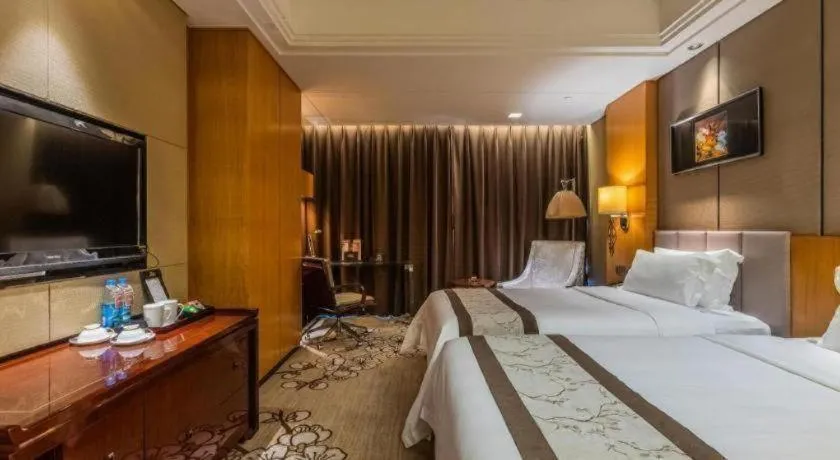 Bed in Zhangjiagang Zhonglian GDH International Hotel