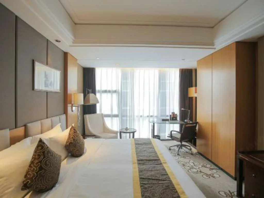 Bed in Zhangjiagang Zhonglian GDH International Hotel