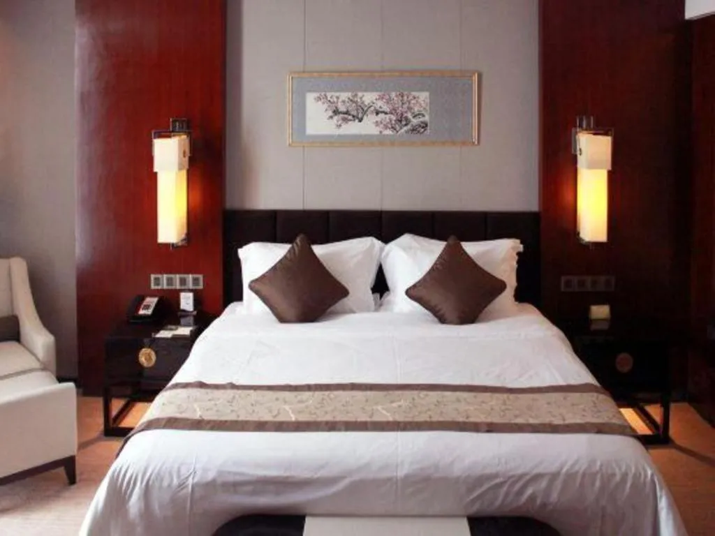 Bed in Zhangjiagang Zhonglian GDH International Hotel