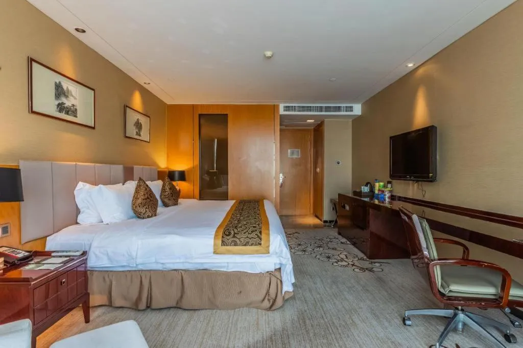 Bed in Zhangjiagang Zhonglian GDH International Hotel