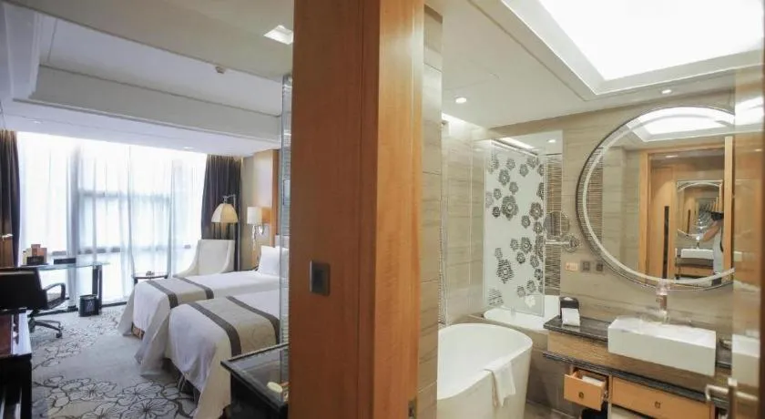 Bed in Zhangjiagang Zhonglian GDH International Hotel