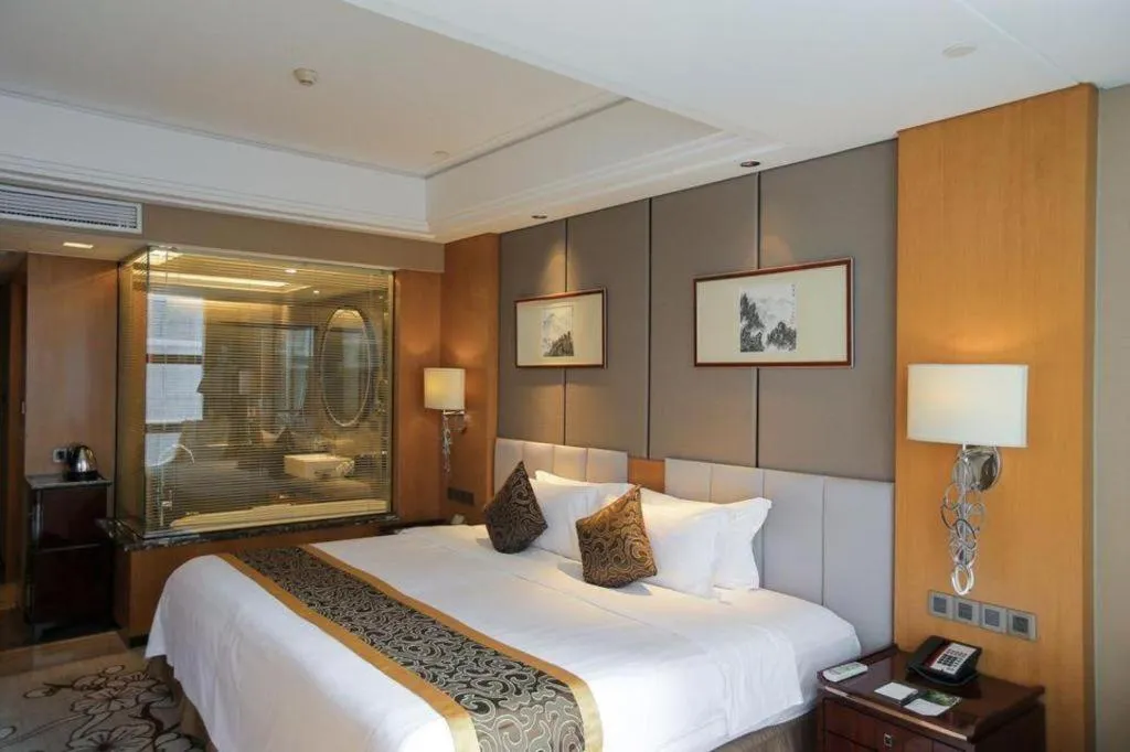 Bed in Zhangjiagang Zhonglian GDH International Hotel