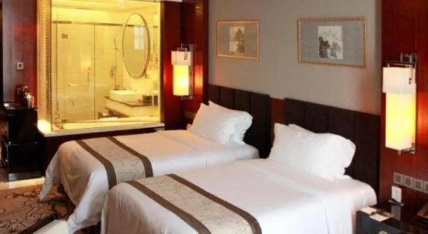 Bed in Zhangjiagang Zhonglian GDH International Hotel