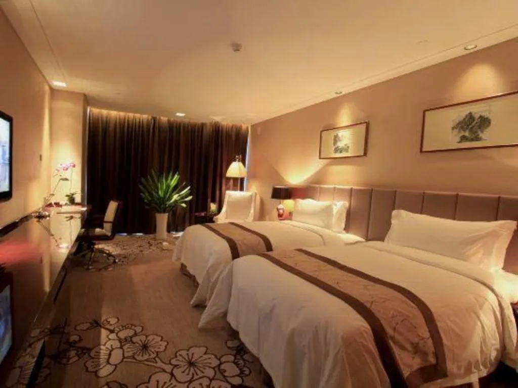 Bed in Zhangjiagang Zhonglian GDH International Hotel