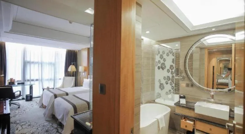 Bed in Zhangjiagang Zhonglian GDH International Hotel