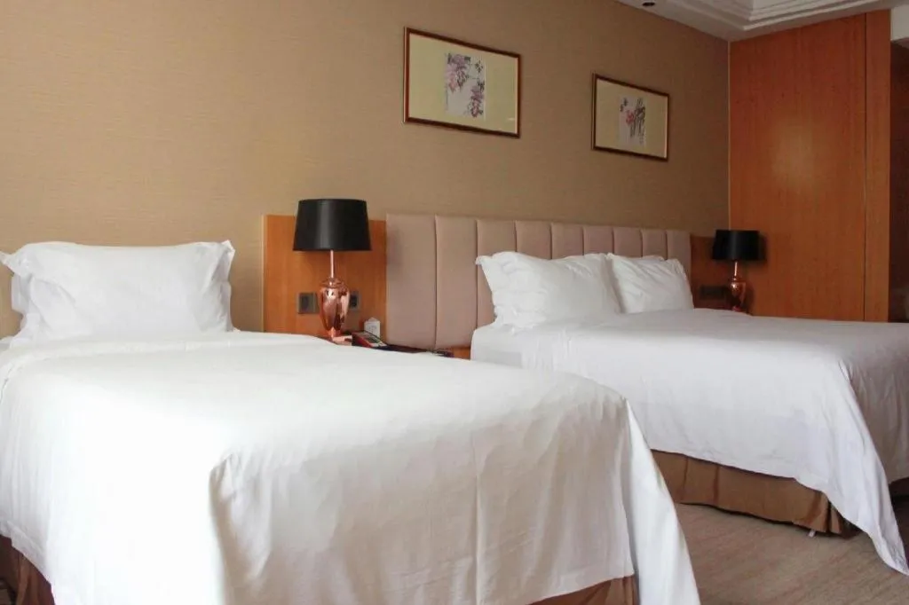 Bed in Zhangjiagang Zhonglian GDH International Hotel