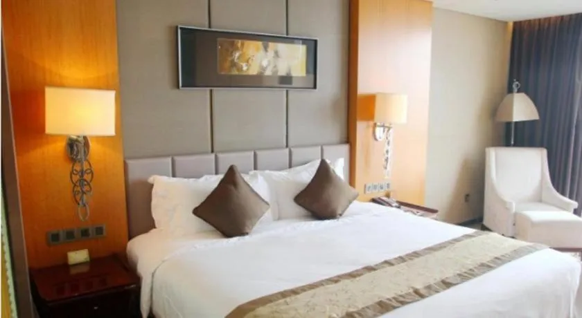 Bed in Zhangjiagang Zhonglian GDH International Hotel