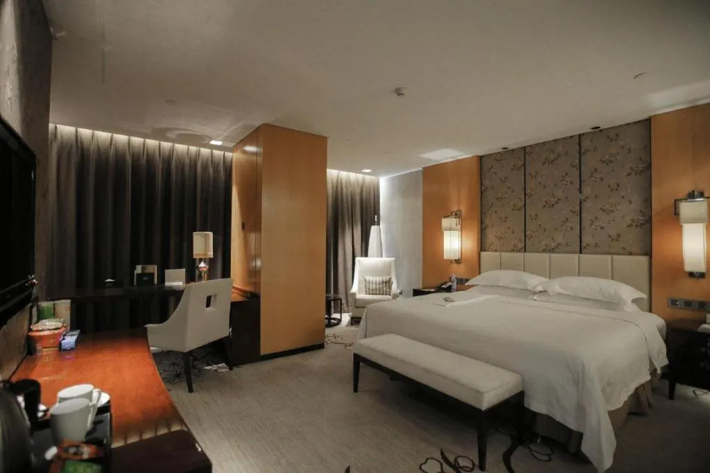 Bed in Zhangjiagang Zhonglian GDH International Hotel