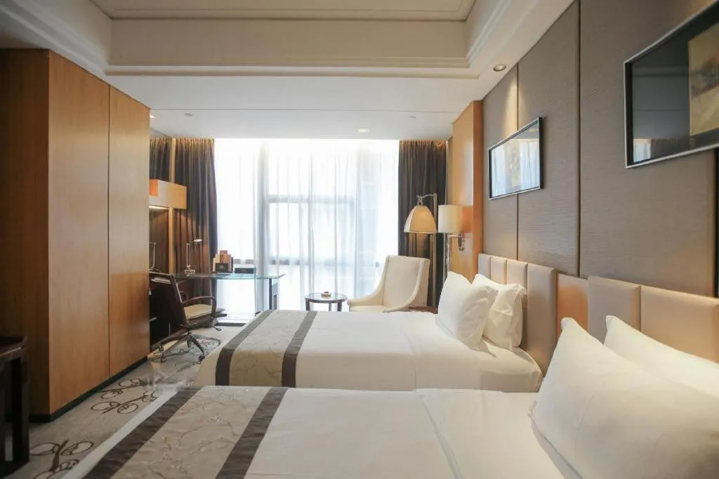 Bed in Zhangjiagang Zhonglian GDH International Hotel